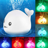 Juguetes de baño con luz LED y ballena de dibujos animados para bebé, flotando y rociando agua, con música ligera